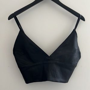 This small thin leather top is lined silk 34 /35 -B/C .